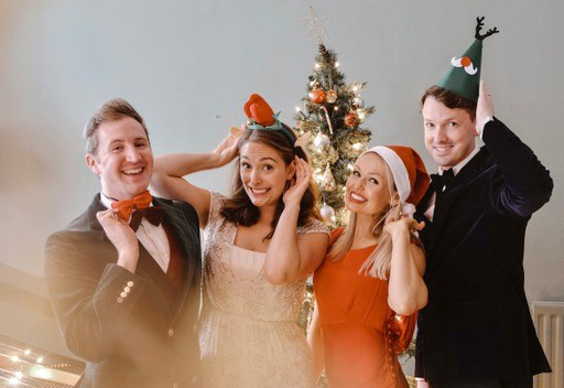 A group of four adults celebrating Christmas 